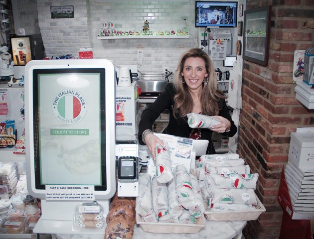 The Italian Place register and founder with sandwiches