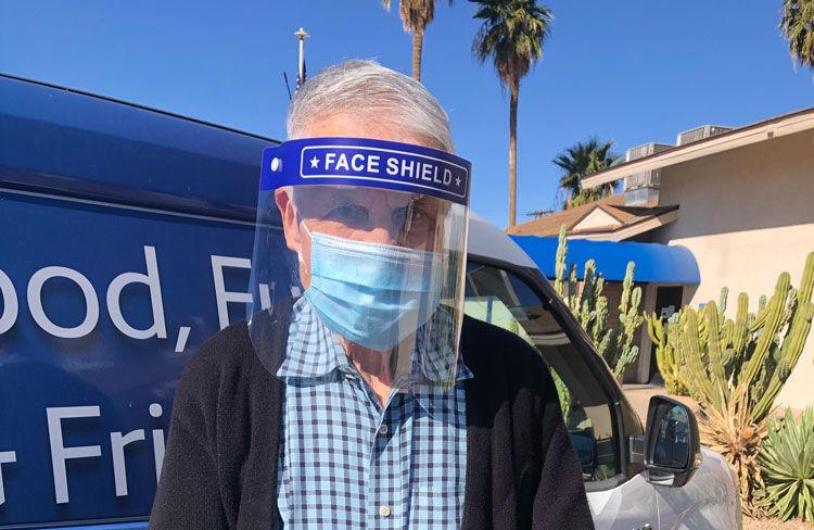 Senior Care A man wears a face mask and shield for COVID-19 protection